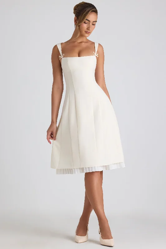 Midi dresses with halter necks for a stylish and comfortable option Bow-Detail Pleated A-Line Midi Dress in Ivory Midi dresses with halter necks for a stylish and comfortable option Bow-Detail Pleated A-Line Midi Dress in Ivory